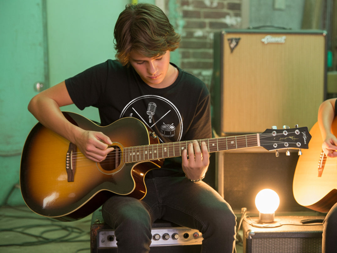Boy practicing guitar